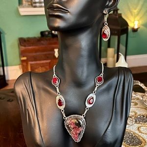 Sterling silver stone pendant with red topaz and matching earrings.